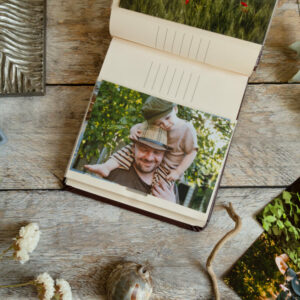Photo printing, frame shop concept. Picture album with printed photos and samples of frames.