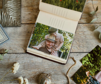 Photo printing, frame shop concept. Picture album with printed photos and samples of frames.