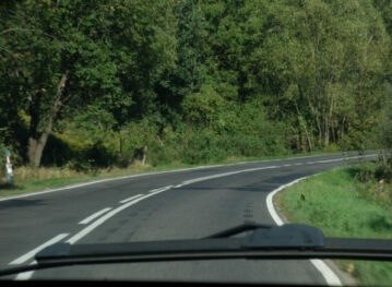 view from a car driving down a mountain road